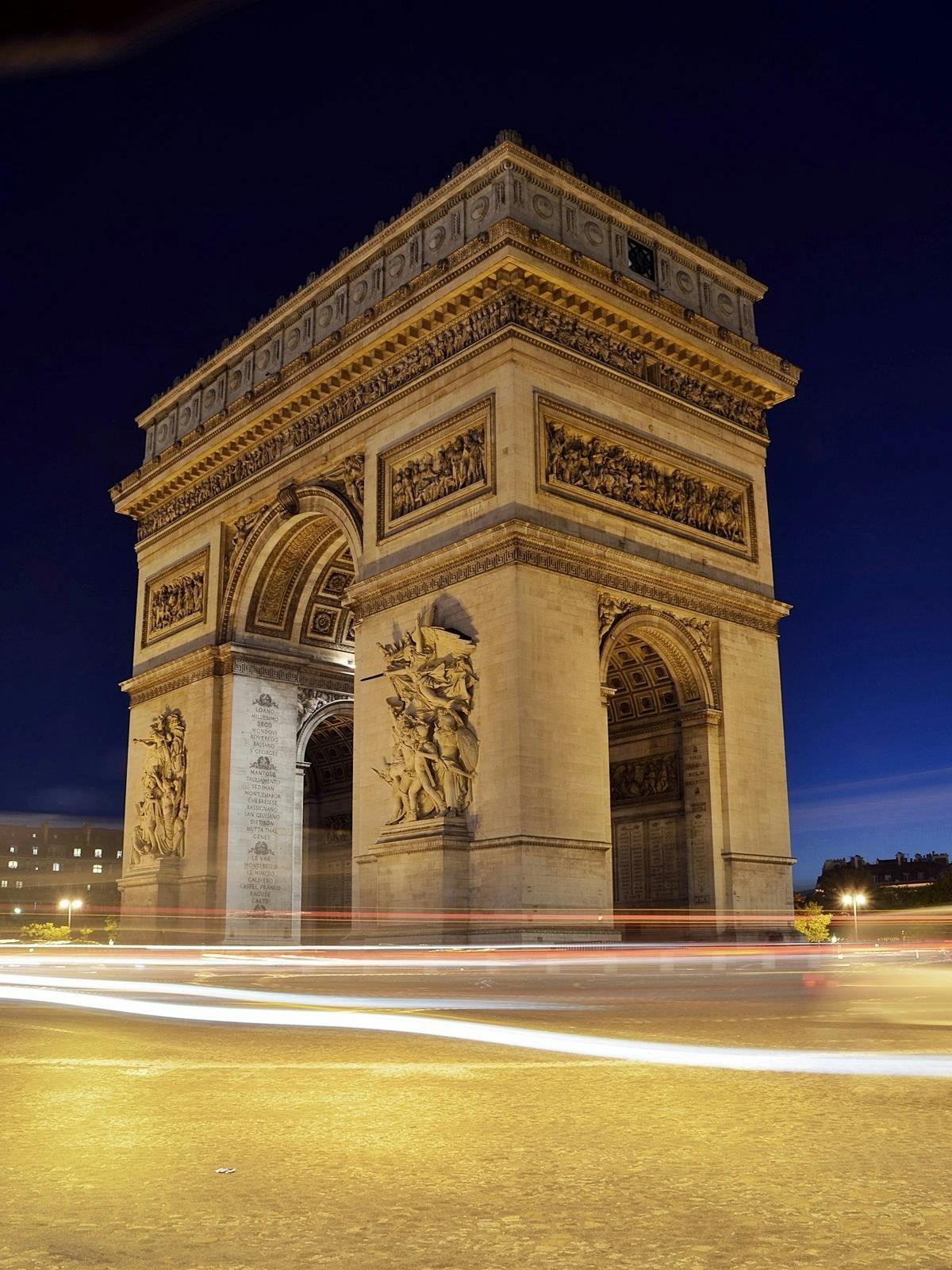 Iconic Parisian monument with neoclassical architecture, ornate stone details, and elegant nighttime illumination. Prime location near prestigious landmarks.